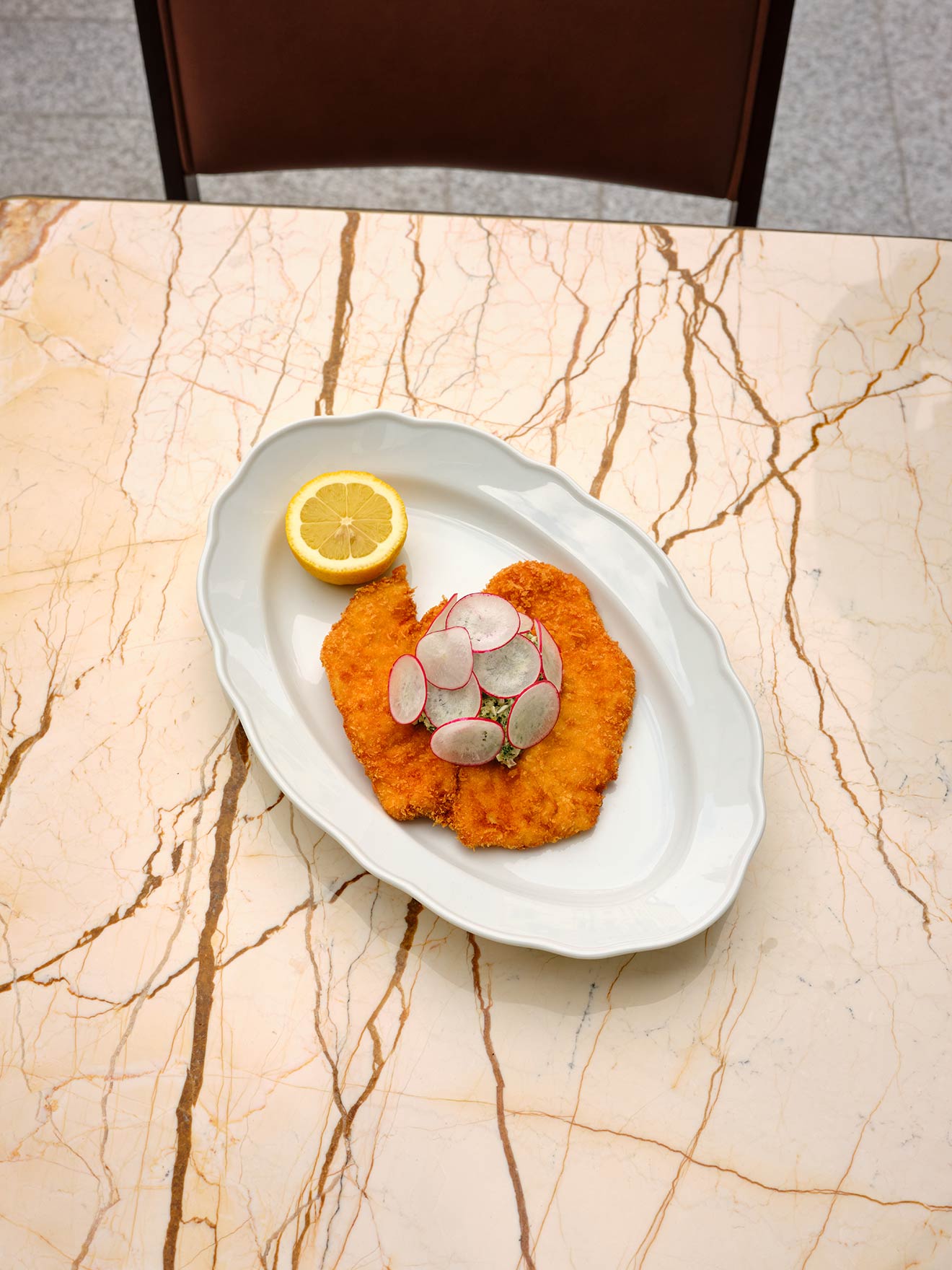 Plate of Schnitzel with a lemon wedge