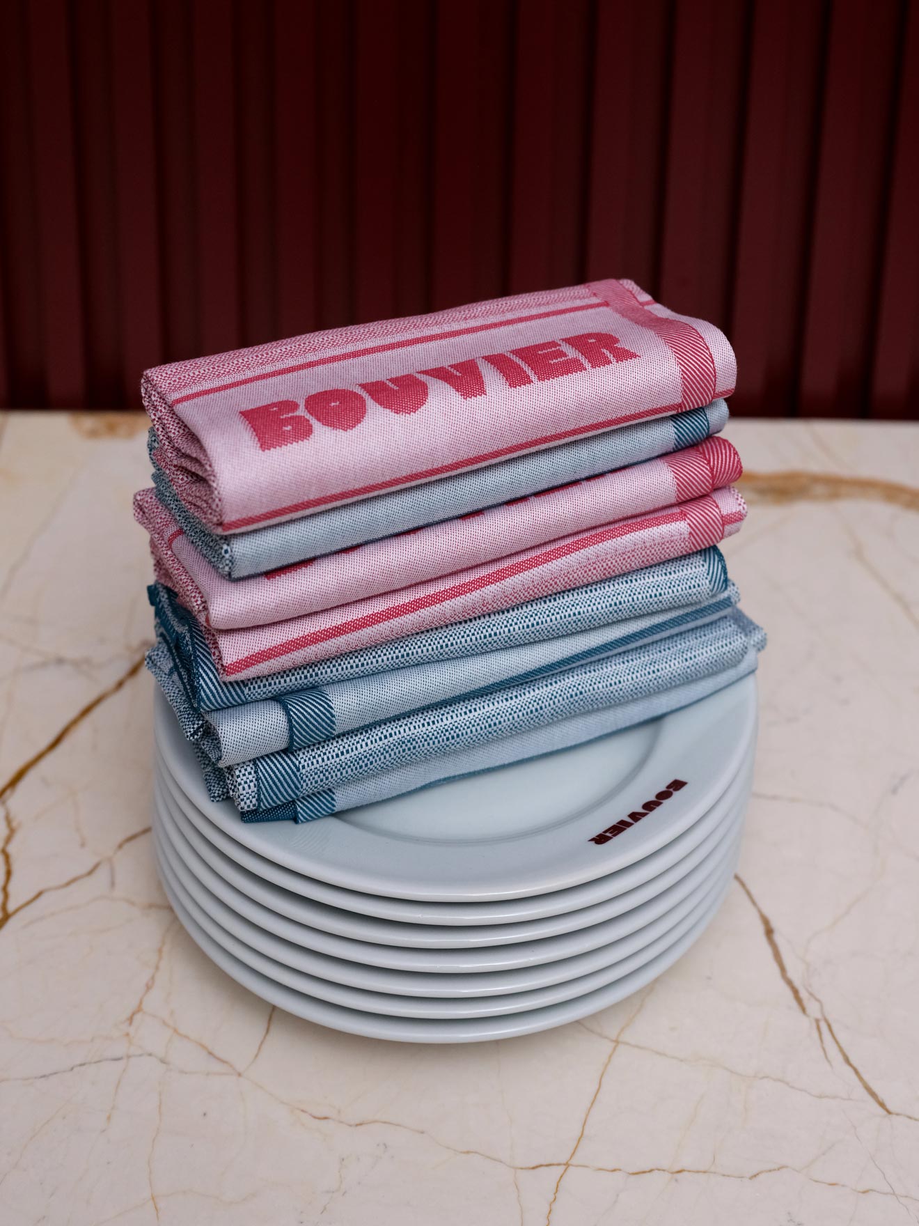 Stack of branded napkins on plates